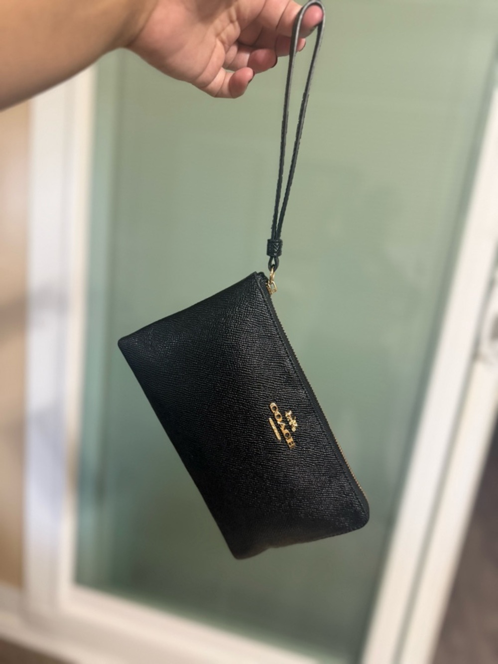 Coach Black Leather Wristlet Pouch with Gold Logo